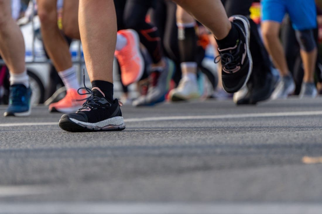 Close-up of runners' feet and shoes during a road race