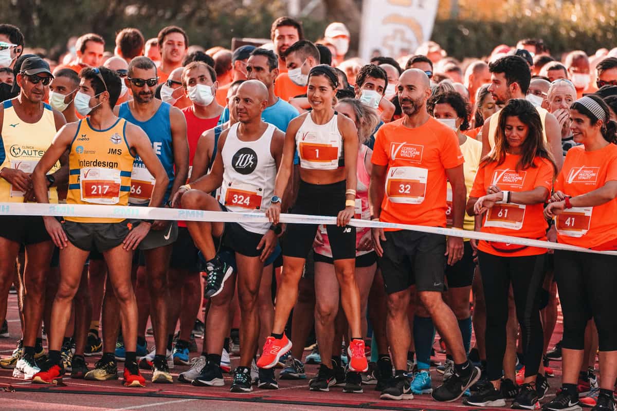 Runners packed at the start line of a road race